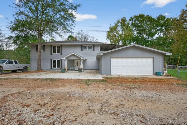 a house with trees in the background