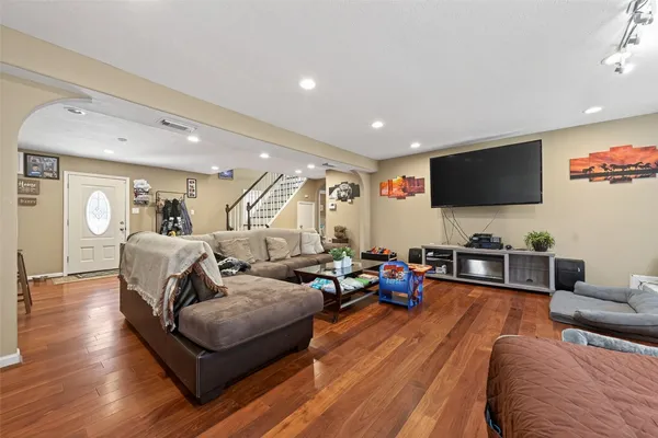 a living room with furniture and a flat screen tv