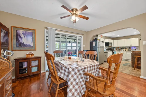 a view of a dining room with furniture window and wooden floor