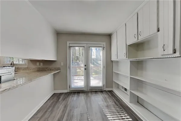 a kitchen with a sink and wooden cabinets