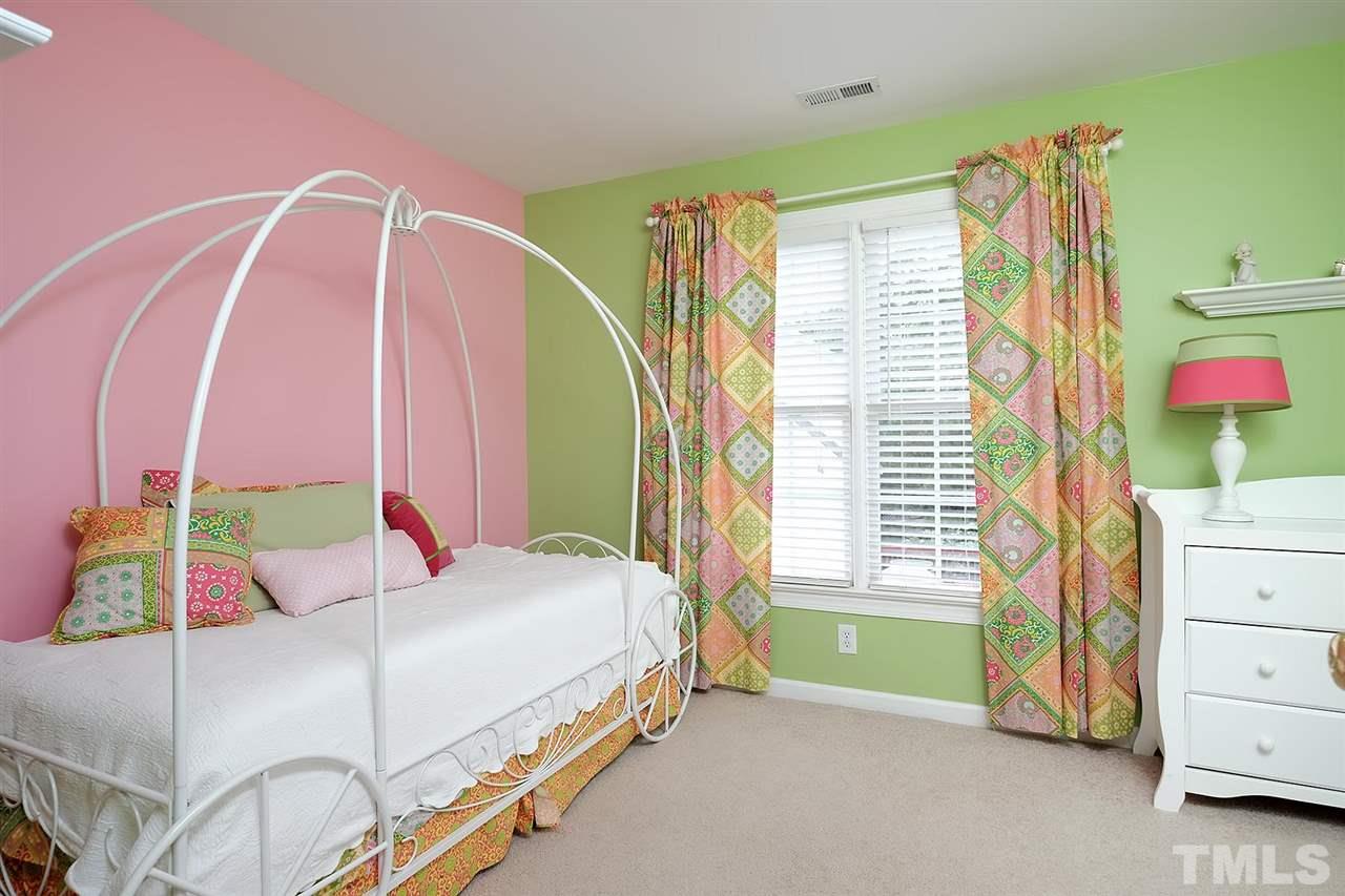 7924 Milltrace Run Raleigh, NC 27615 - Photo 16 of 25 a bedroom with a bed and a window