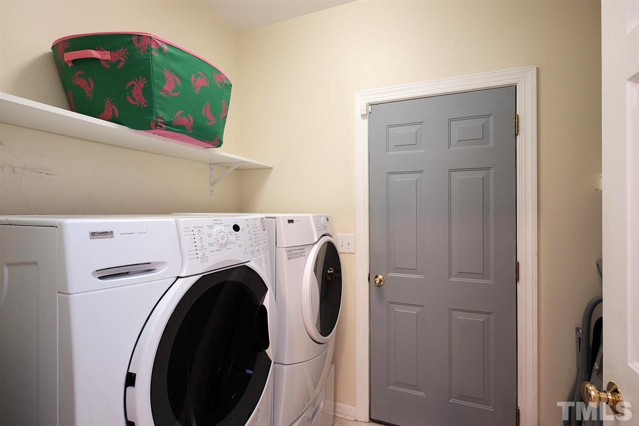 7924 Milltrace Run Raleigh, NC 27615 - Photo 22 of 25 a utility room with dryer and washer