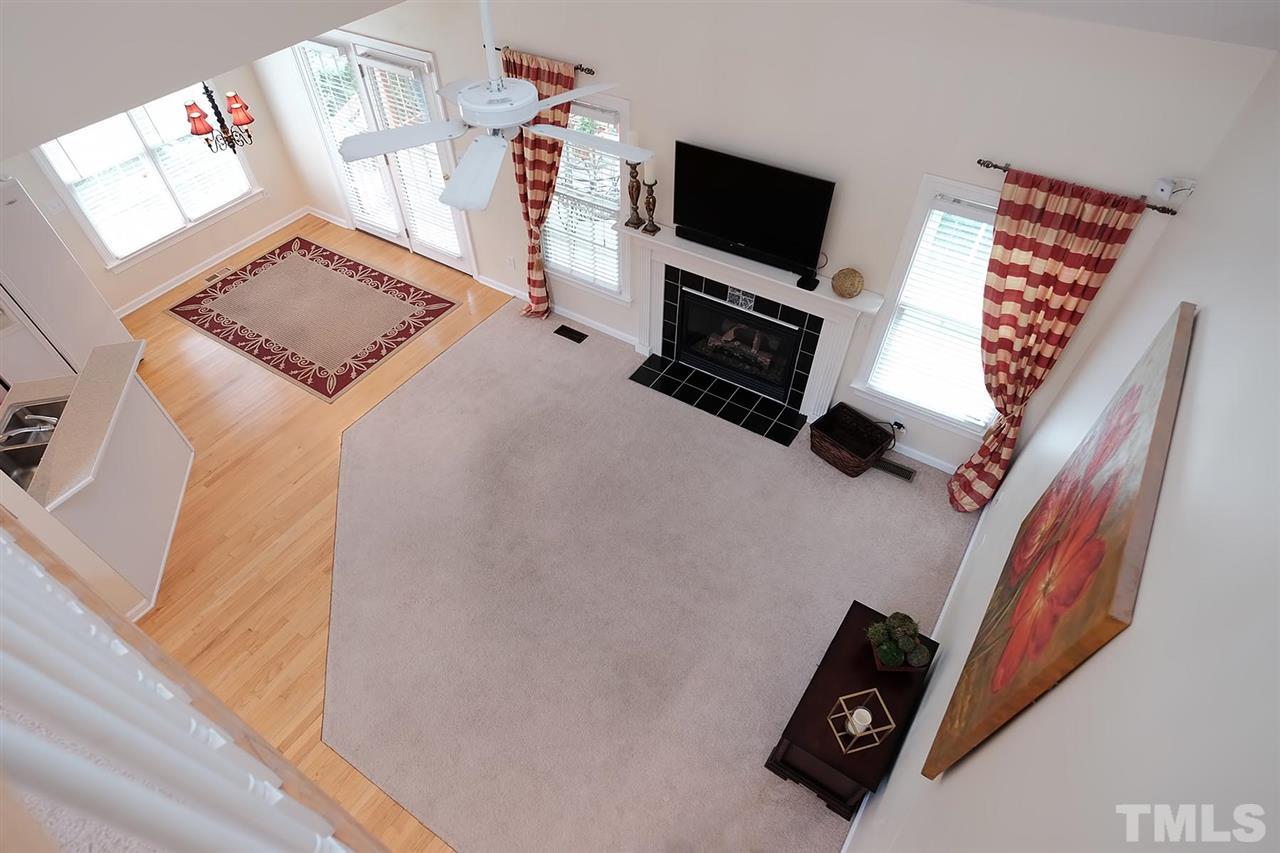 7924 Milltrace Run Raleigh, NC 27615 - Photo 6 of 25 a bedroom with a bed and flat screen tv