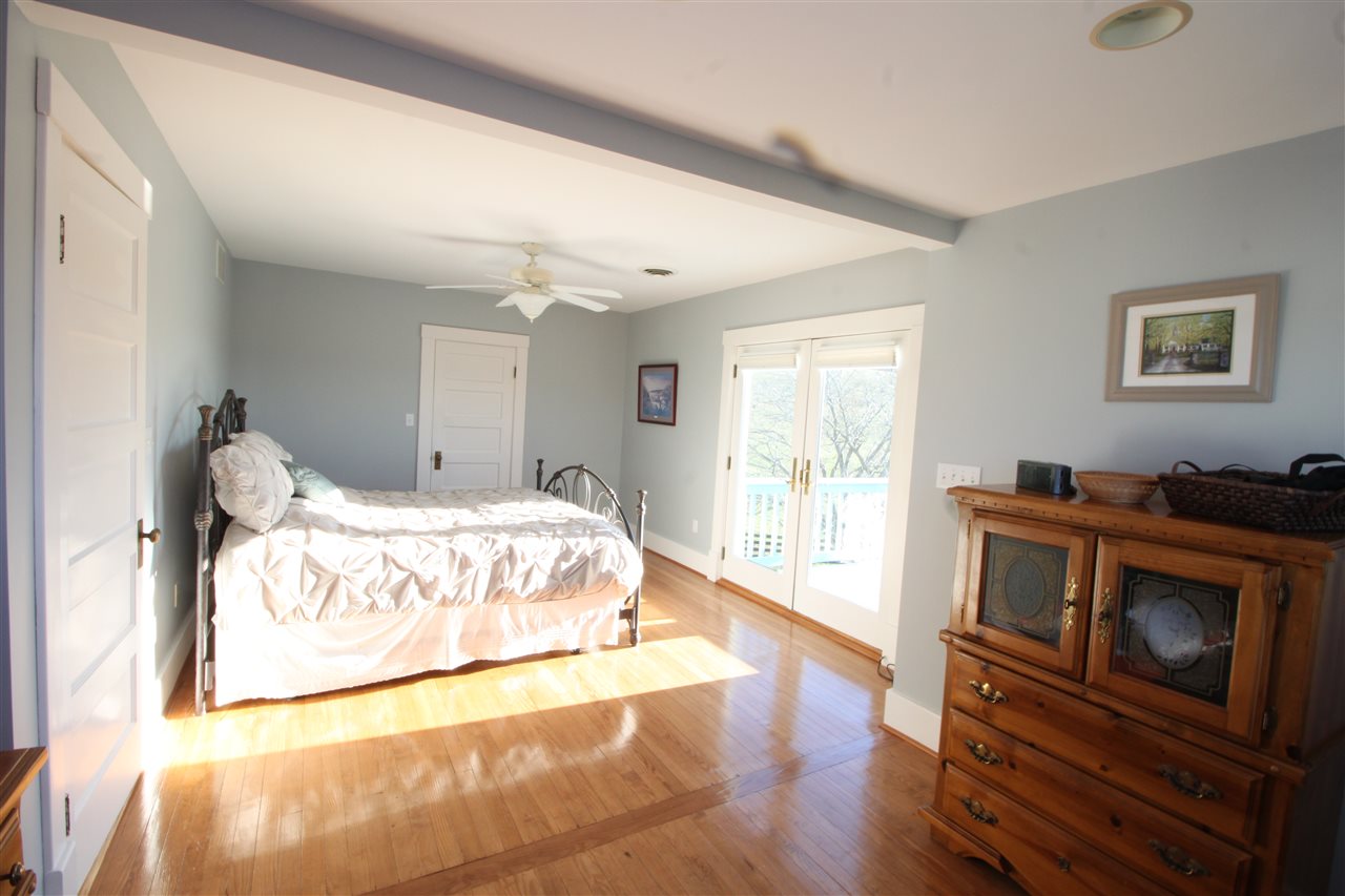 1508 Howardsville Road Staunton, VA 24401 - Photo 13 of 24 a spacious bedroom with a bed and a flat screen tv