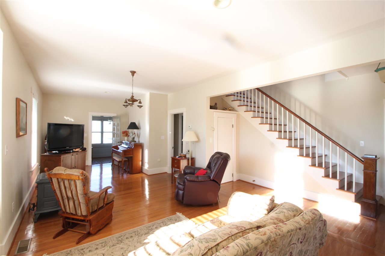 1508 Howardsville Road Staunton, VA 24401 - Photo 3 of 24 a living room with furniture or wooden floor and a flat screen tv