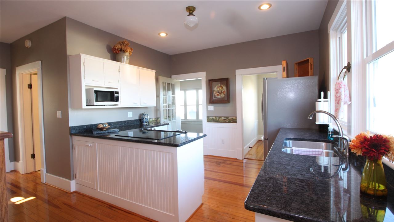 1508 Howardsville Road Staunton, VA 24401 - Photo 6 of 24 a kitchen with granite countertop a sink and a refrigerator