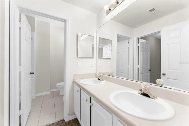 a view of a bathroom with white walls