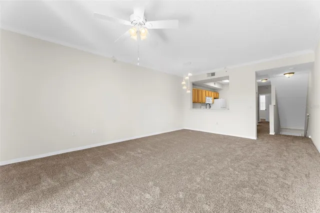 a kitchen with white cabinets sink and white appliances