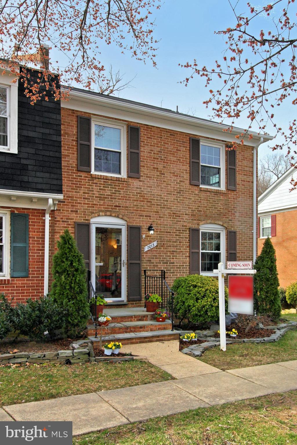 7013 Leestone Street Springfield, VA 22151 - Photo 2 of 36 a view of a house with a yard and plants