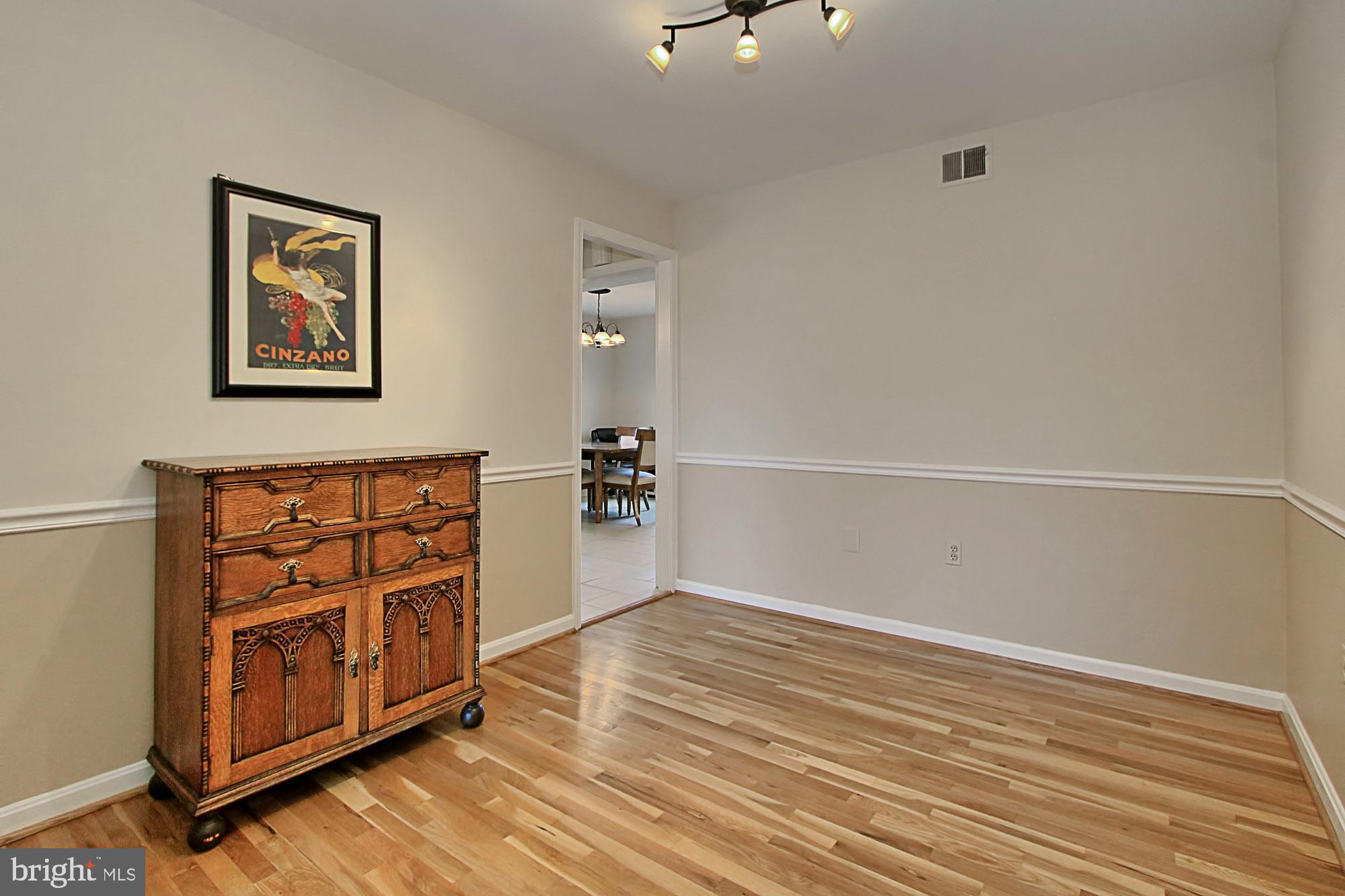 7013 Leestone Street Springfield, VA 22151 - Photo 15 of 36 a view of a livingroom with an empty space and a window