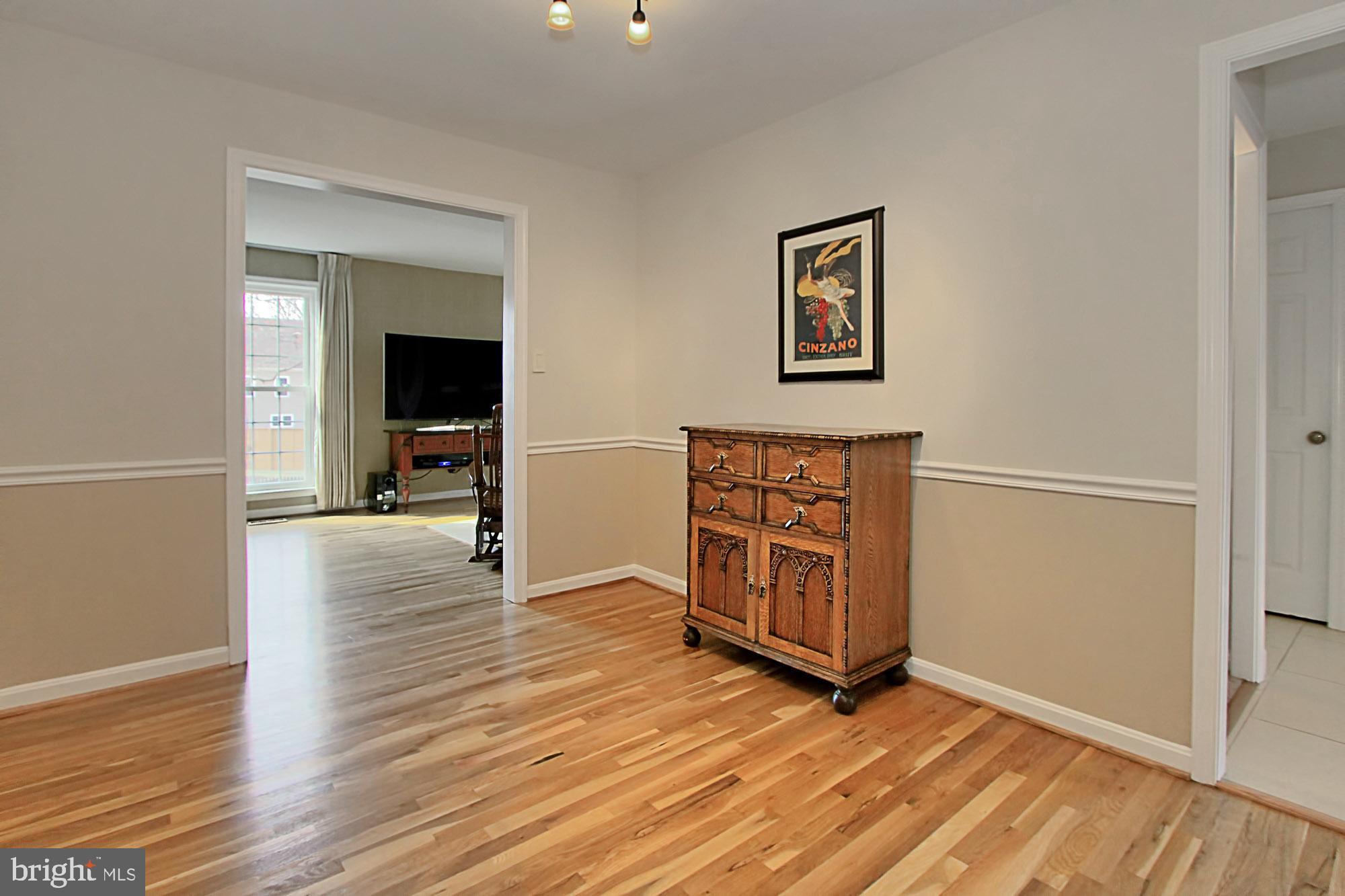7013 Leestone Street Springfield, VA 22151 - Photo 16 of 36 an empty room with wooden floor closet and windows