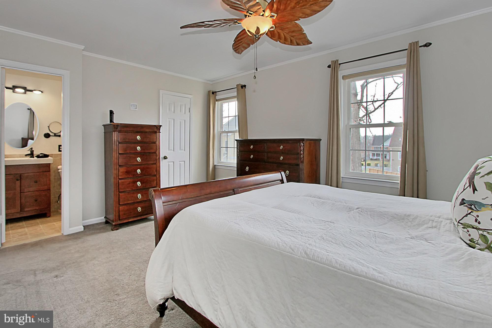 7013 Leestone Street Springfield, VA 22151 - Photo 21 of 36 a bedroom with a bed and a dresser