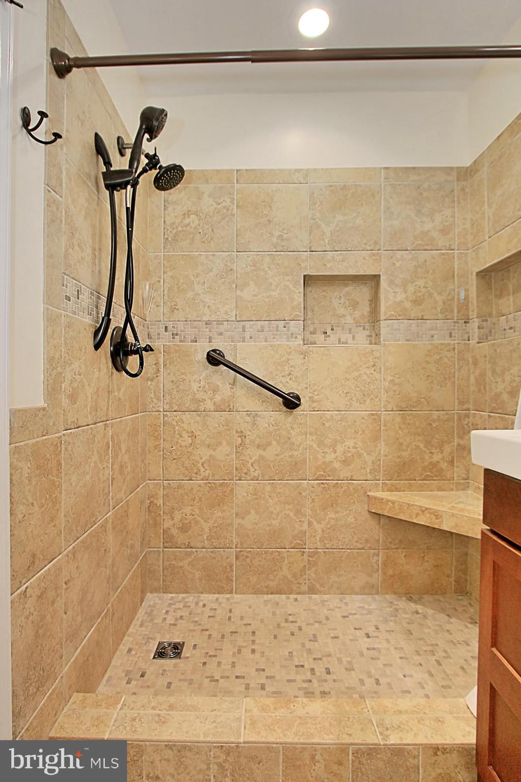 7013 Leestone Street Springfield, VA 22151 - Photo 24 of 36 a bathroom with a shower