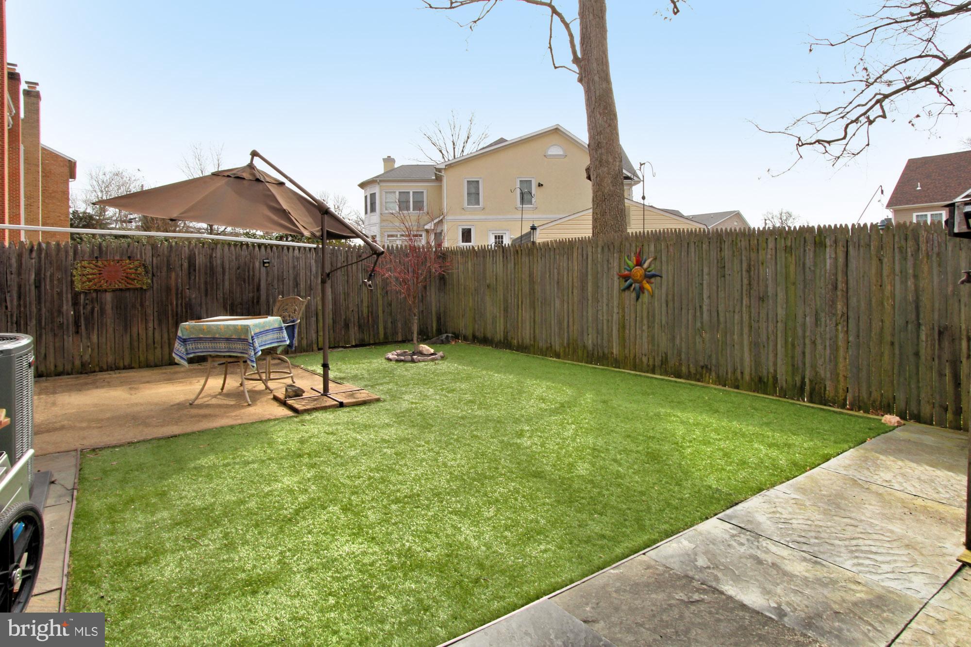 7013 Leestone Street Springfield, VA 22151 - Photo 32 of 36 a view of a chair and table in backyard of the house