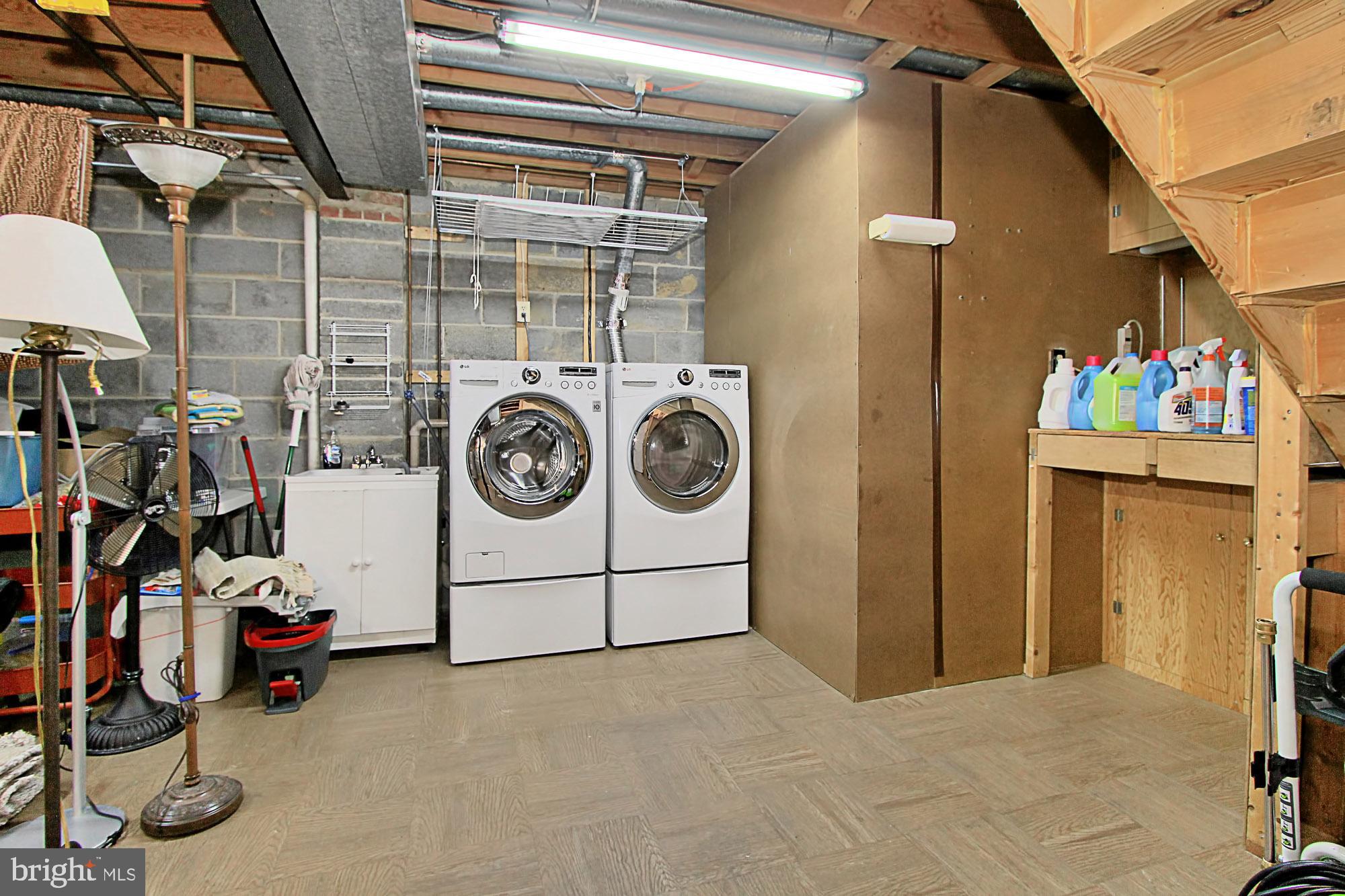7013 Leestone Street Springfield, VA 22151 - Photo 34 of 36 a utility room with dryer and washer
