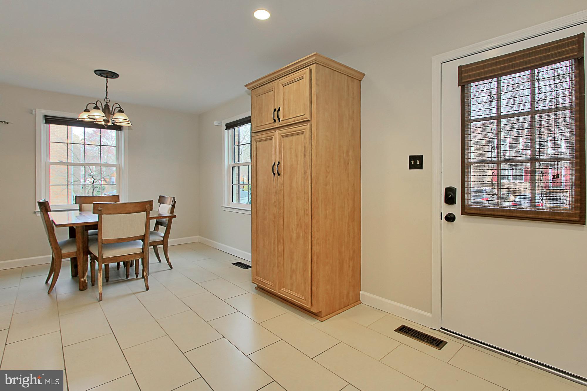 7013 Leestone Street Springfield, VA 22151 - Photo 7 of 36 a dining room with furniture and window