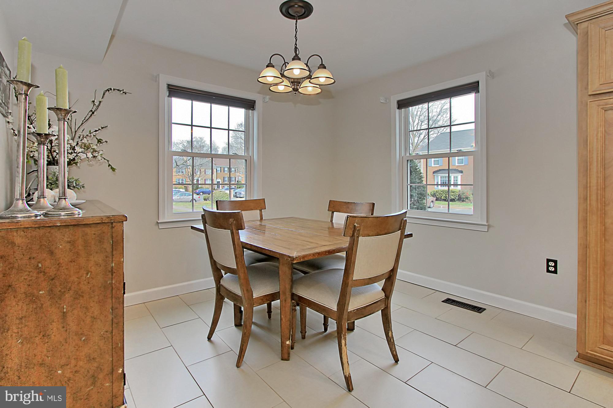 7013 Leestone Street Springfield, VA 22151 - Photo 8 of 36 a dining room with furniture and window