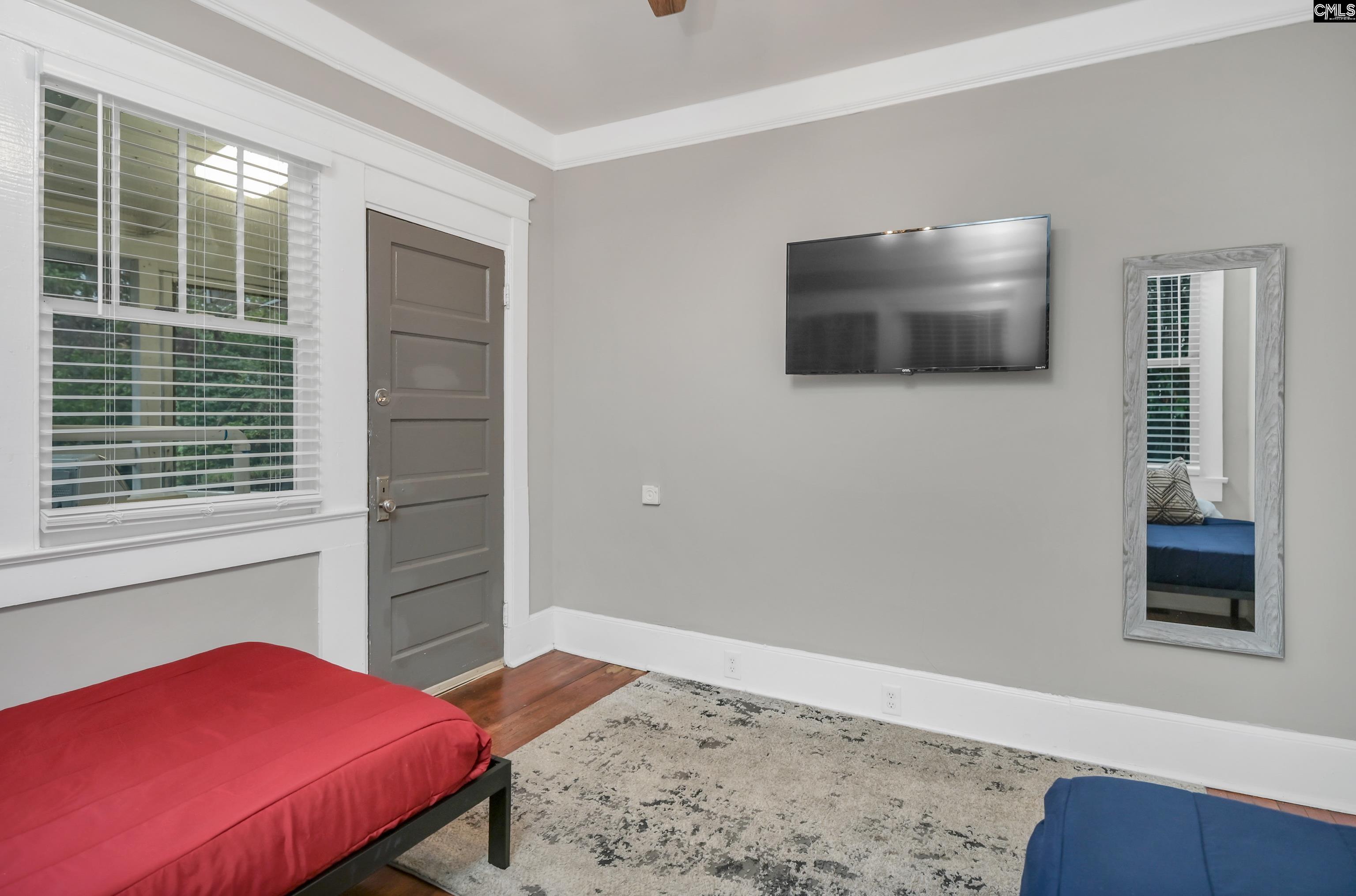 2227 Bull Street Columbia, SC 29201 - Photo 34 of 38 a bedroom with a bed and a window