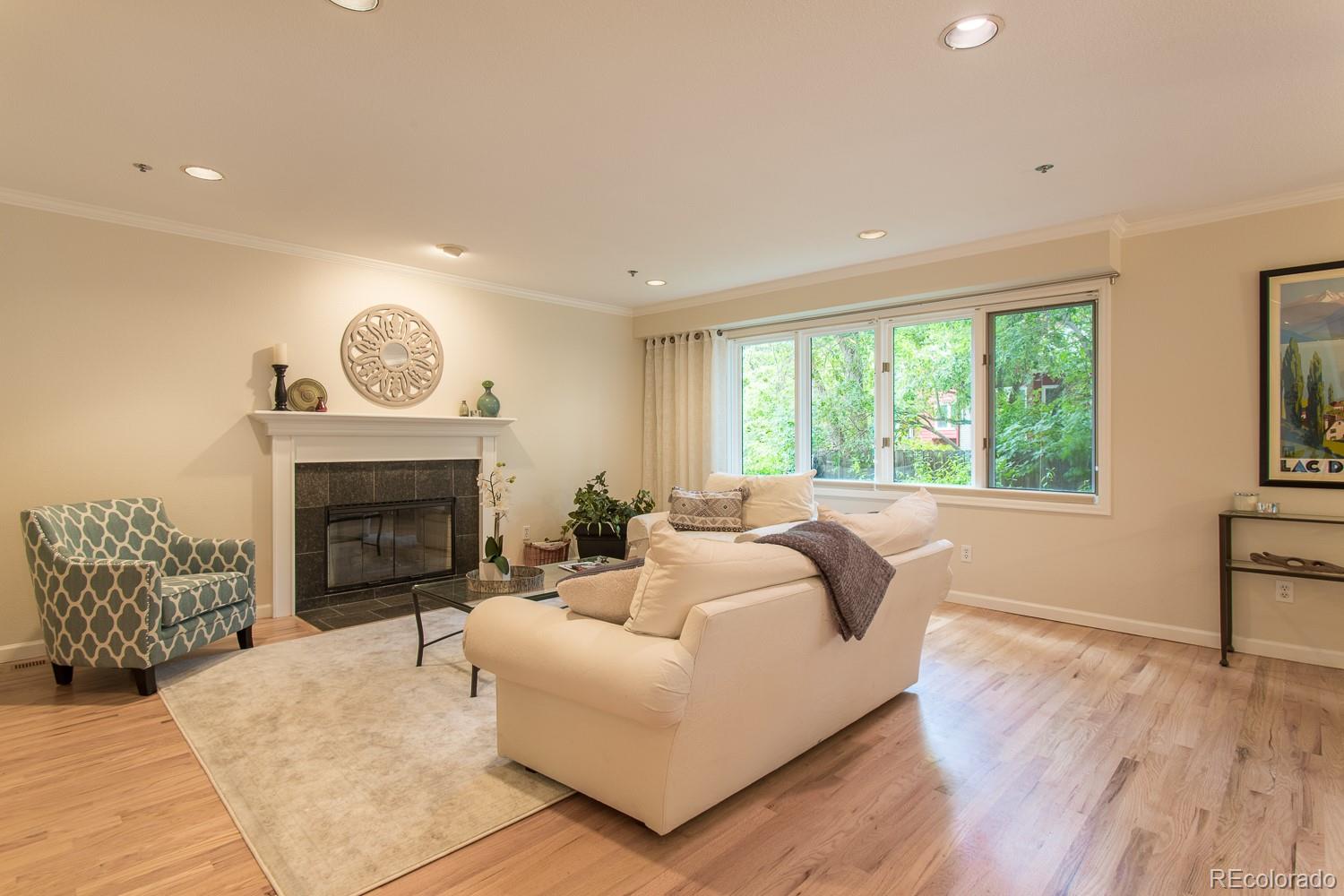 1151 Juniper Avenue Boulder, CO 80304 - Photo 11 of 37 a living room with furniture and a fireplace