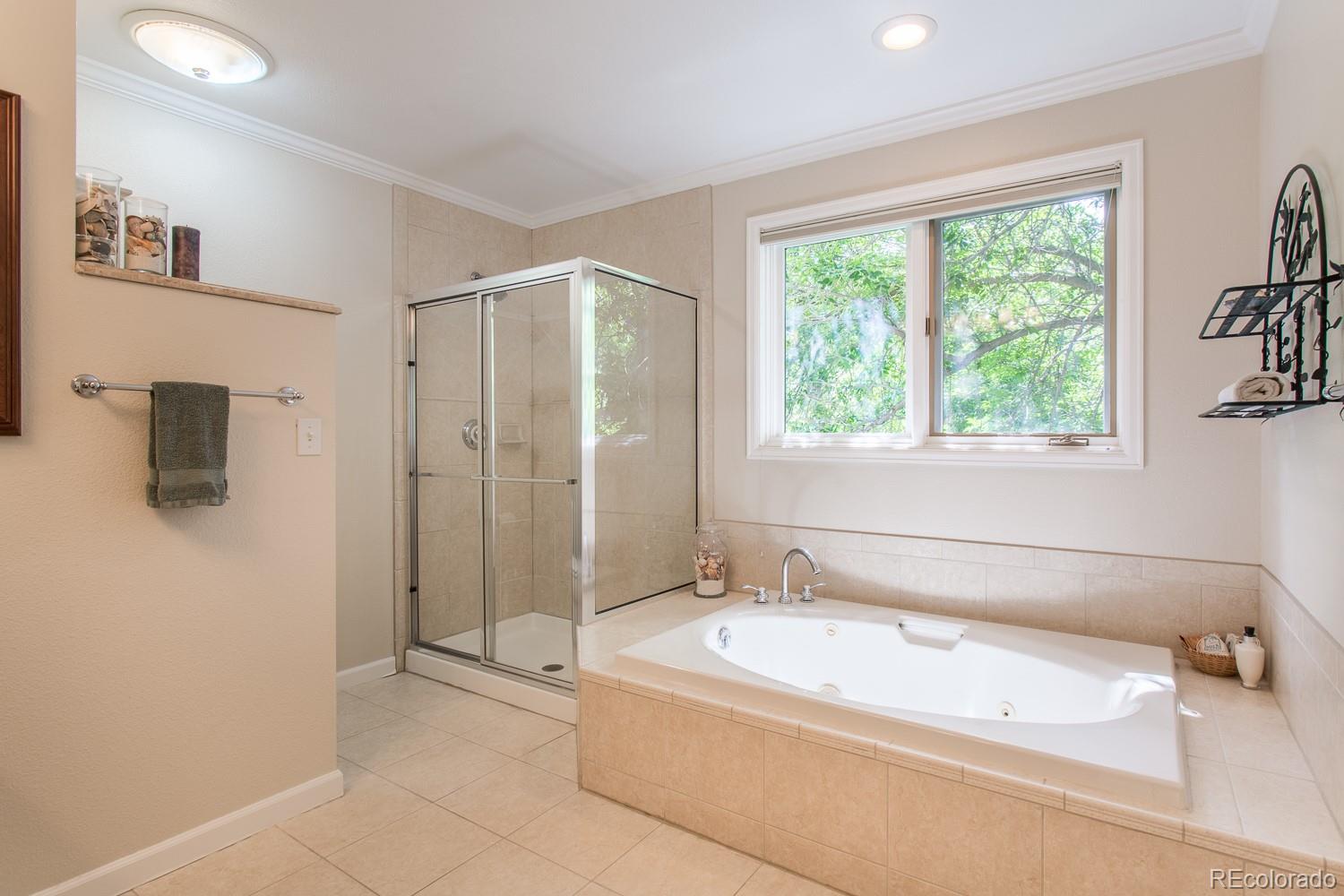 1151 Juniper Avenue Boulder, CO 80304 - Photo 14 of 37 a spacious bathroom with a granite countertop tub shower and a sink