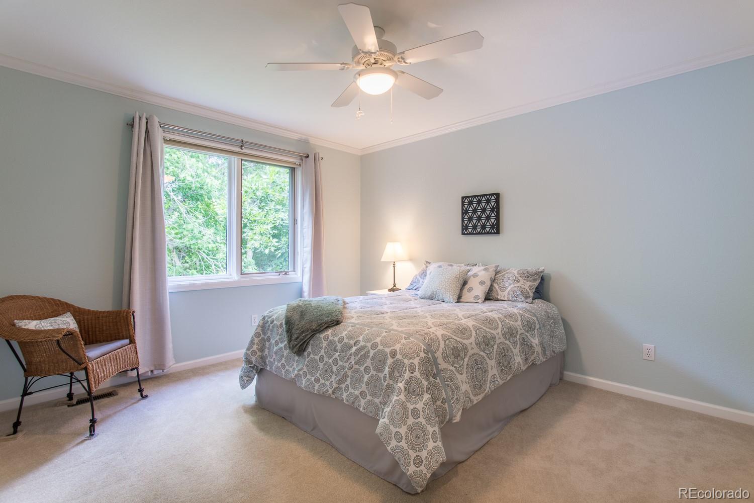 1151 Juniper Avenue Boulder, CO 80304 - Photo 16 of 37 a bedroom with a bed and chair