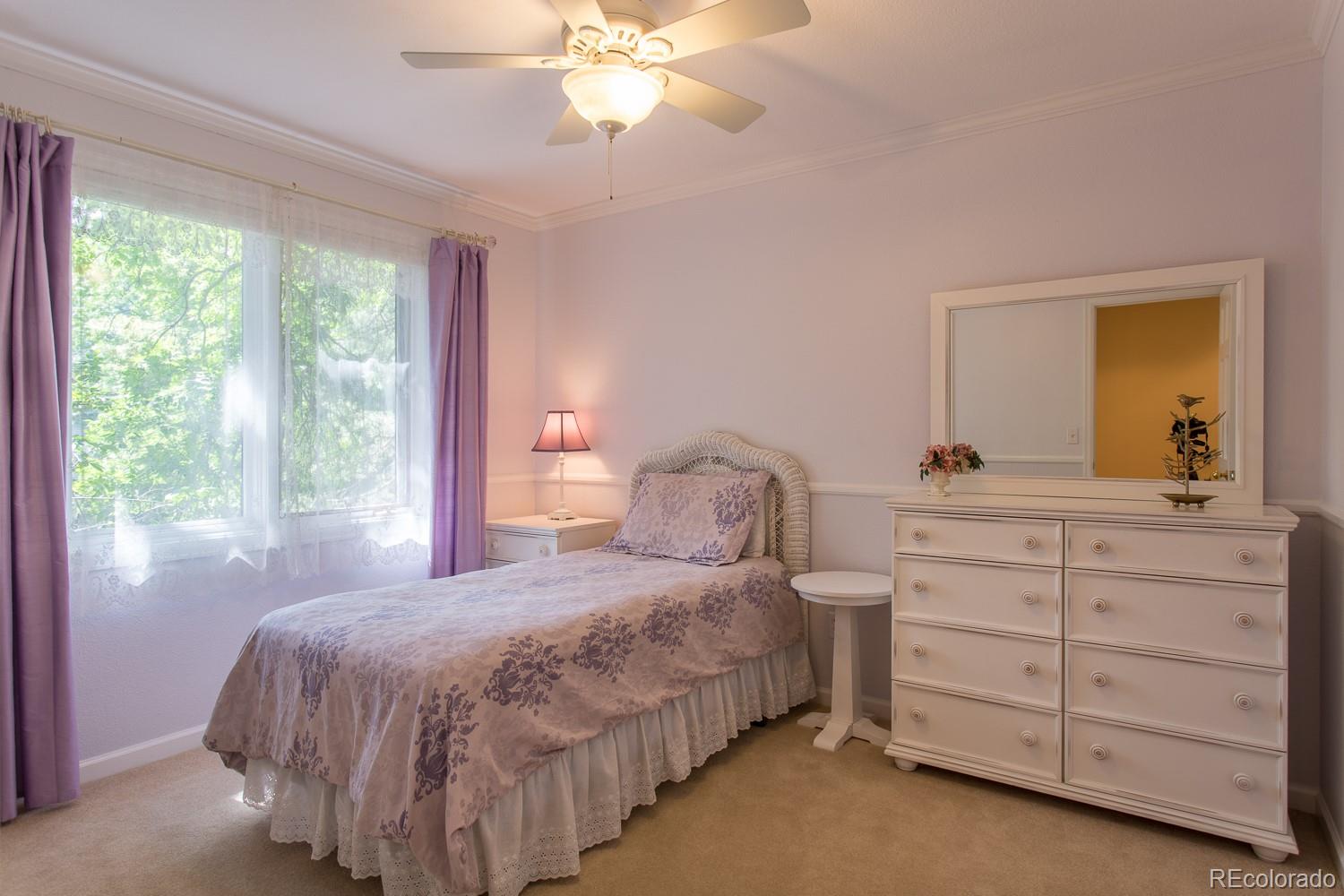 1151 Juniper Avenue Boulder, CO 80304 - Photo 18 of 37 a bedroom with a bed and a dresser