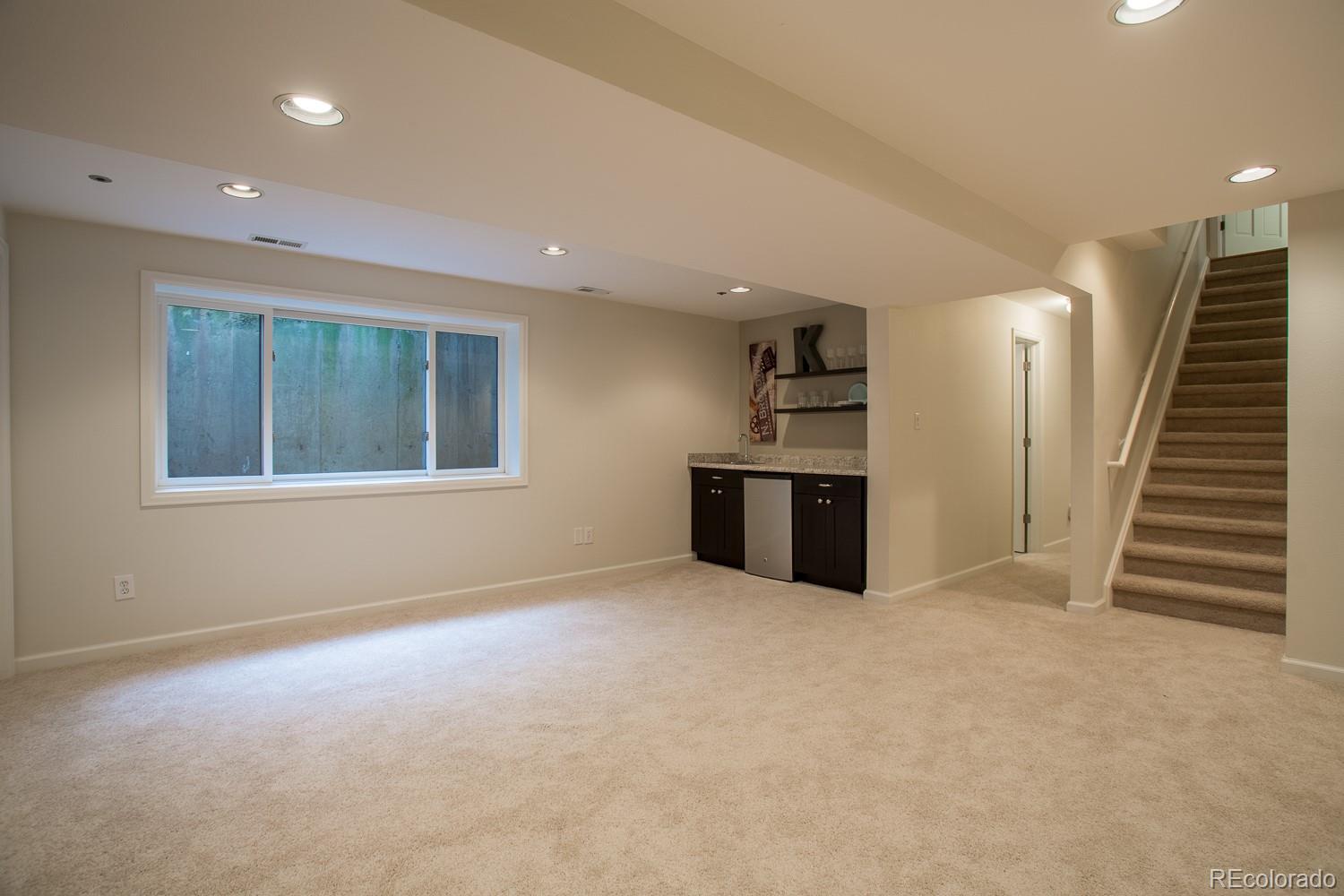 1151 Juniper Avenue Boulder, CO 80304 - Photo 20 of 37 an empty room with a fireplace and entryway