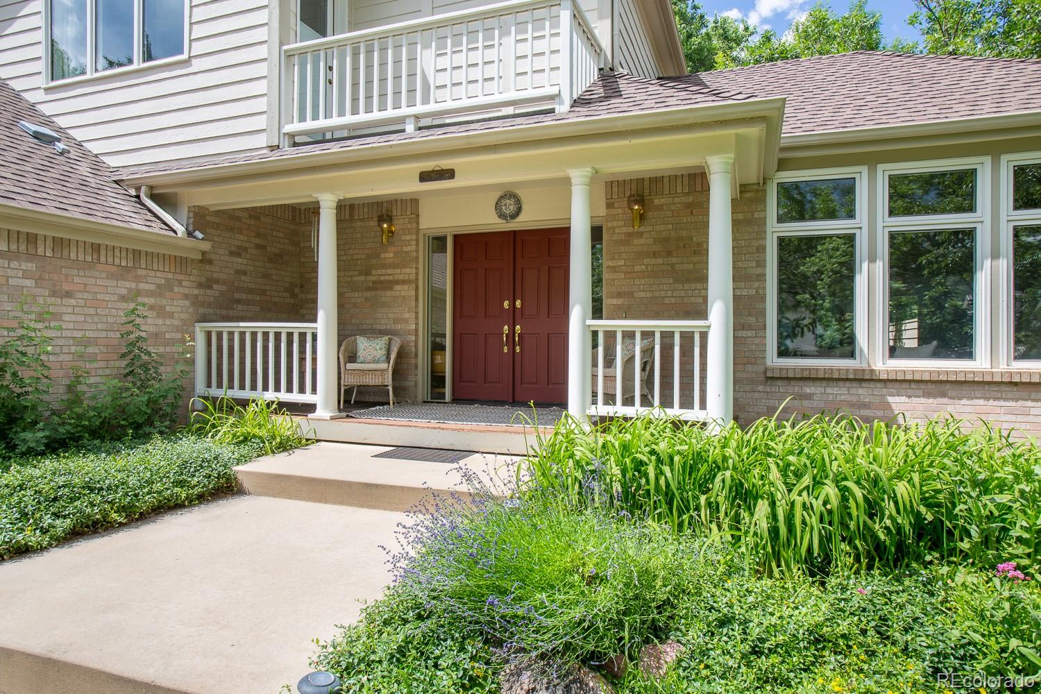 1151 Juniper Avenue Boulder, CO 80304 - Photo 2 of 37 a front view of a house with a garden