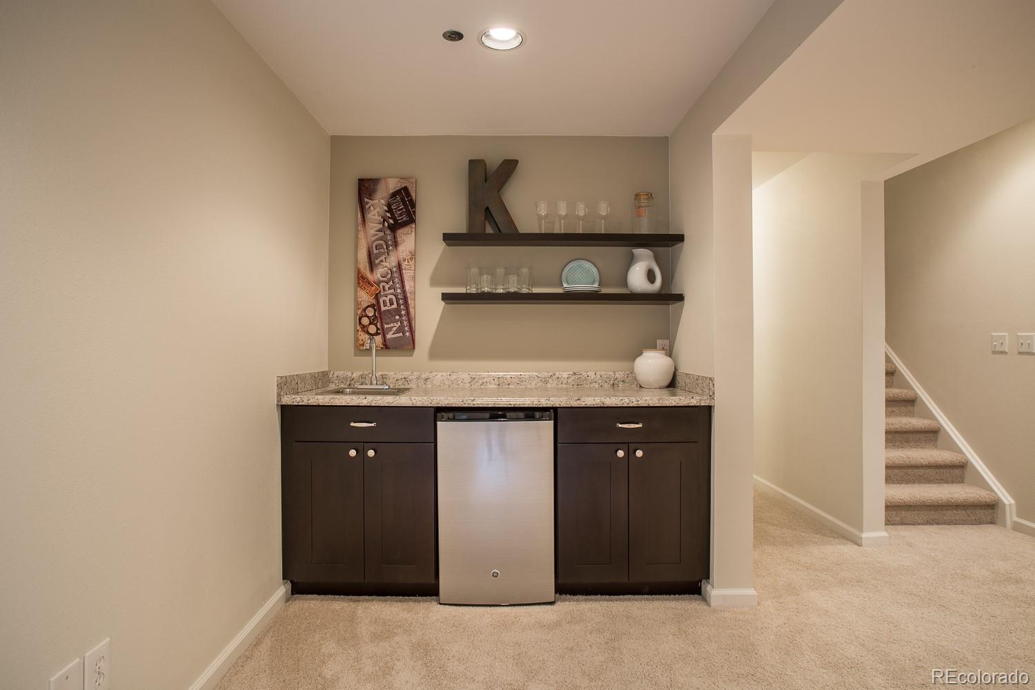 1151 Juniper Avenue Boulder, CO 80304 - Photo 21 of 37 a kitchen with a sink a stove and cabinets
