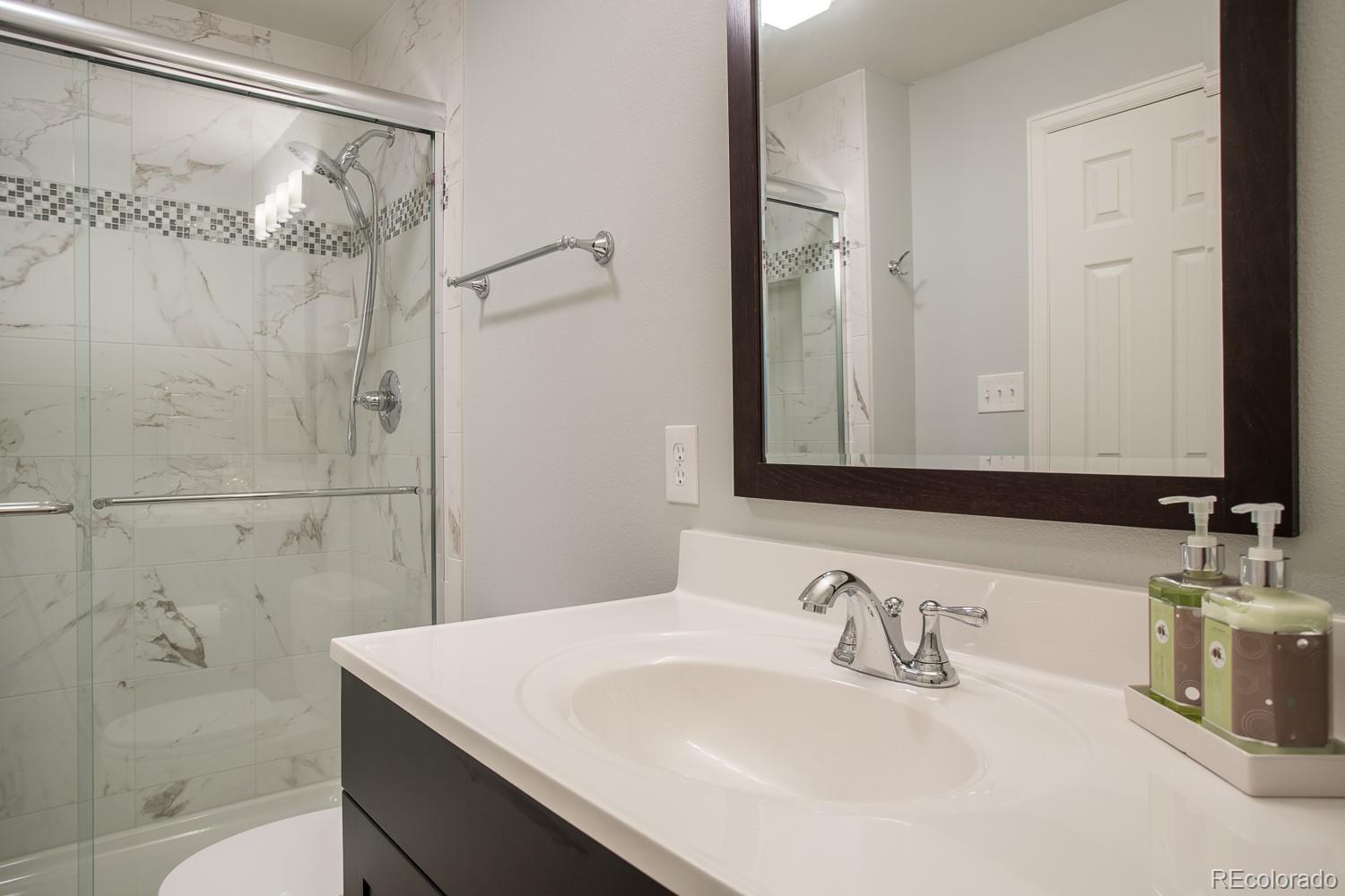 1151 Juniper Avenue Boulder, CO 80304 - Photo 22 of 37 a bathroom with a sink and a mirror