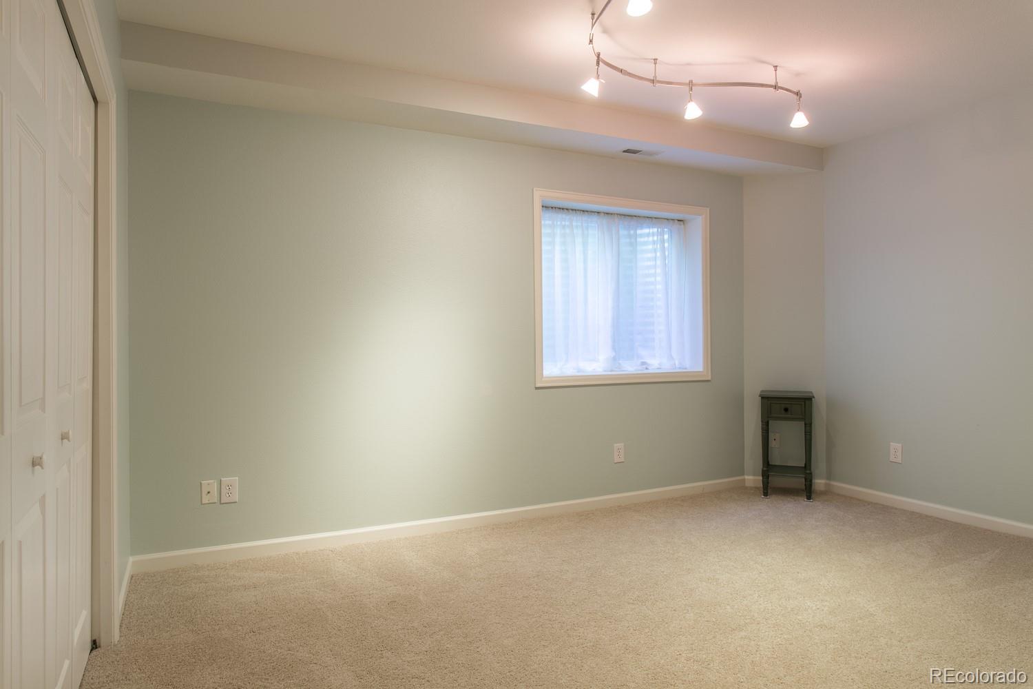 1151 Juniper Avenue Boulder, CO 80304 - Photo 23 of 37 an empty room with a window and a fan