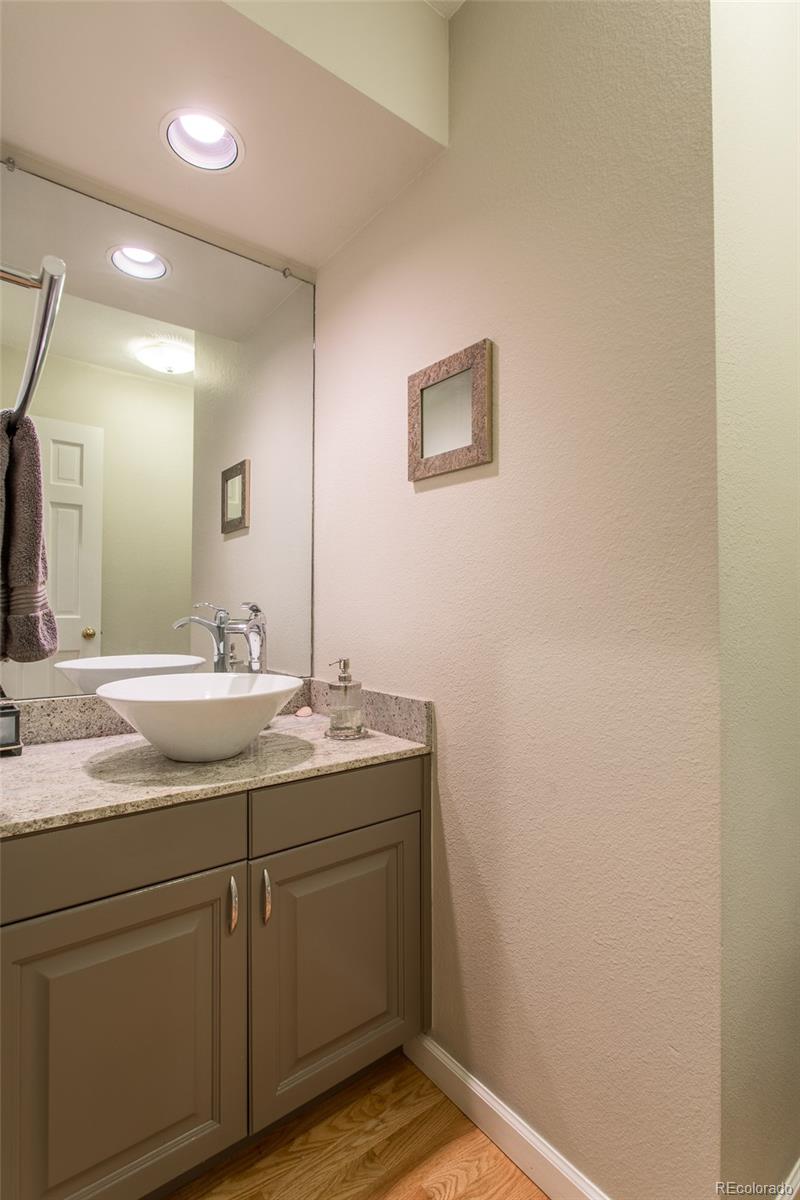 1151 Juniper Avenue Boulder, CO 80304 - Photo 25 of 37 a bathroom with a granite countertop sink and a mirror