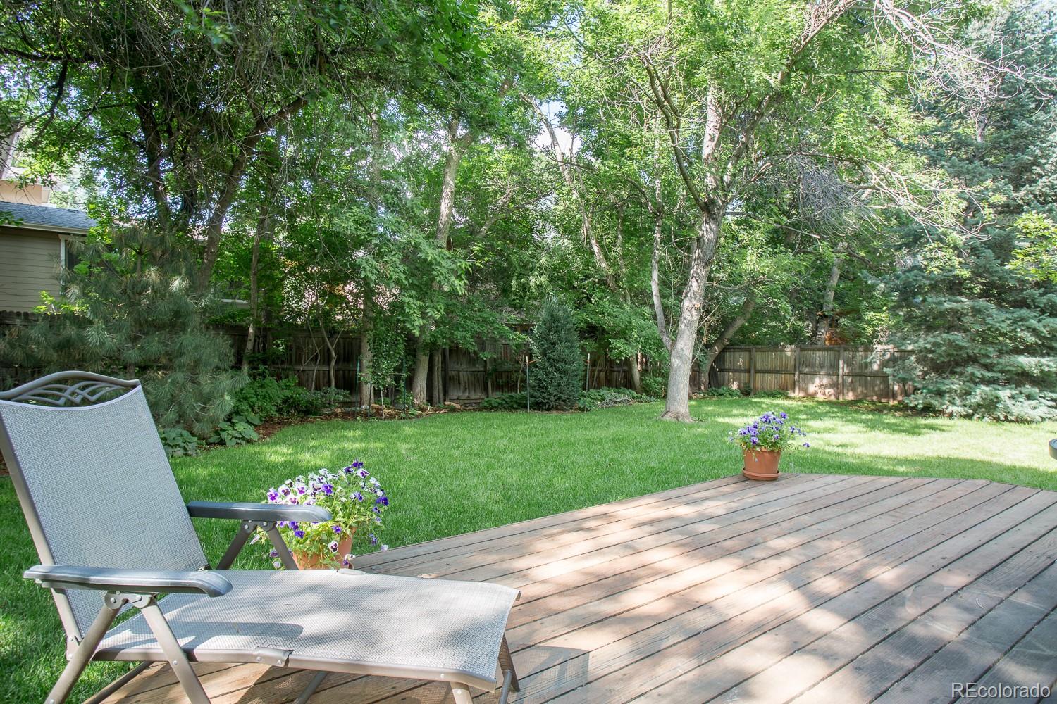 1151 Juniper Avenue Boulder, CO 80304 - Photo 32 of 37 a view of a backyard with sitting area and garden
