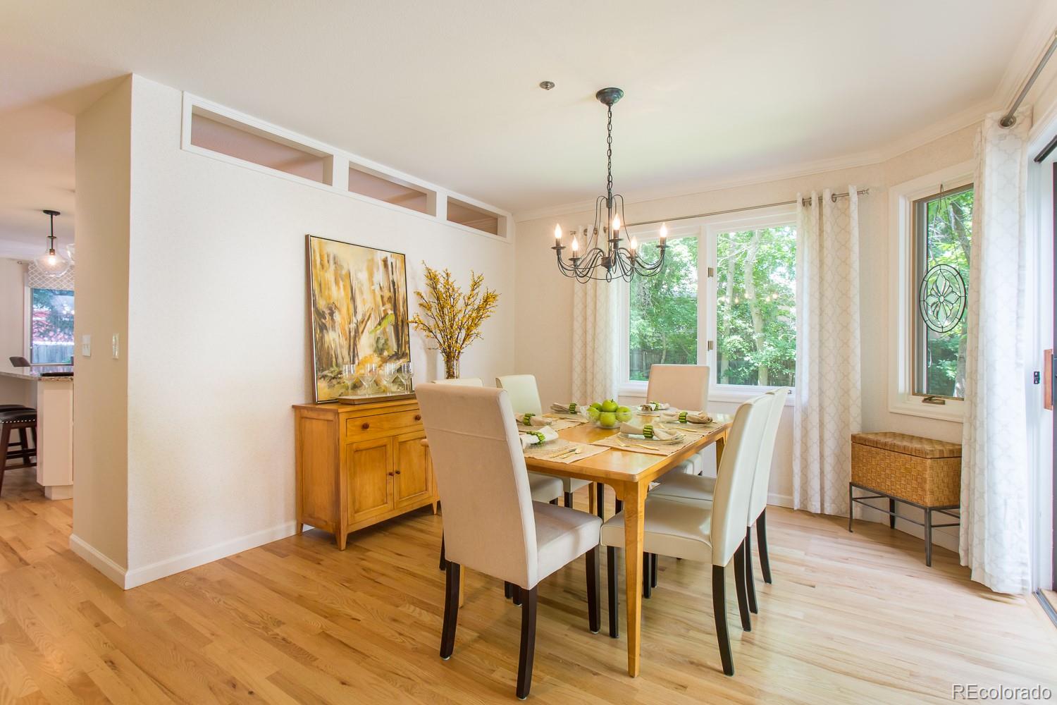 1151 Juniper Avenue Boulder, CO 80304 - Photo 9 of 37 a view of a dining room with furniture window and wooden floor
