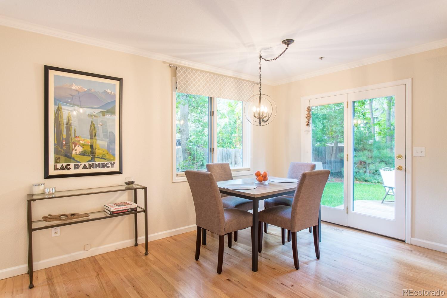 1151 Juniper Avenue Boulder, CO 80304 - Photo 10 of 37 a view of a dining room with furniture window and wooden floor