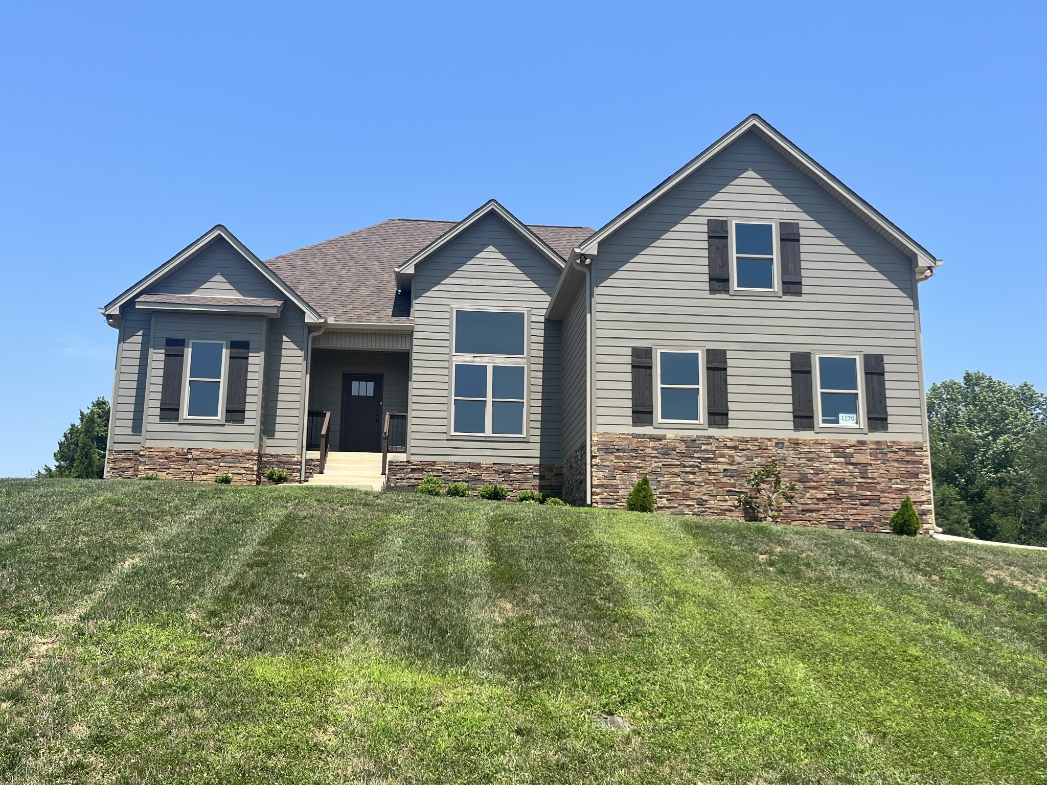 a front view of a house with a yard