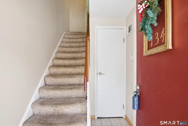 a view of entryway with a front door