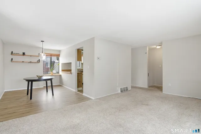 a view of a livingroom with furniture and wooden floor