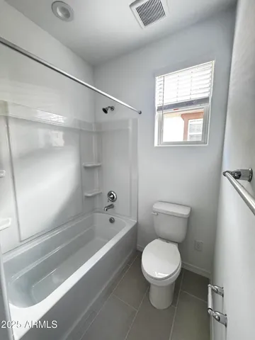 a bathroom with a toilet a sink and bathtub