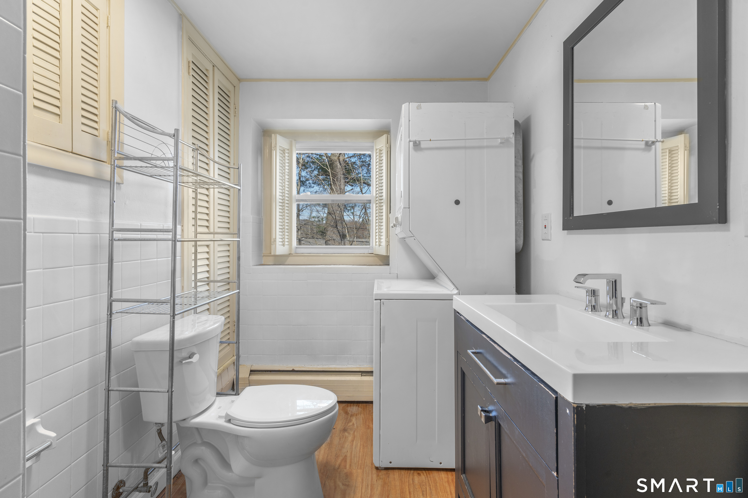 9 Daniel Road, Unit 9B Bristol, CT 06010 - Photo 7 of 16 a bathroom with a sink toilet and shower