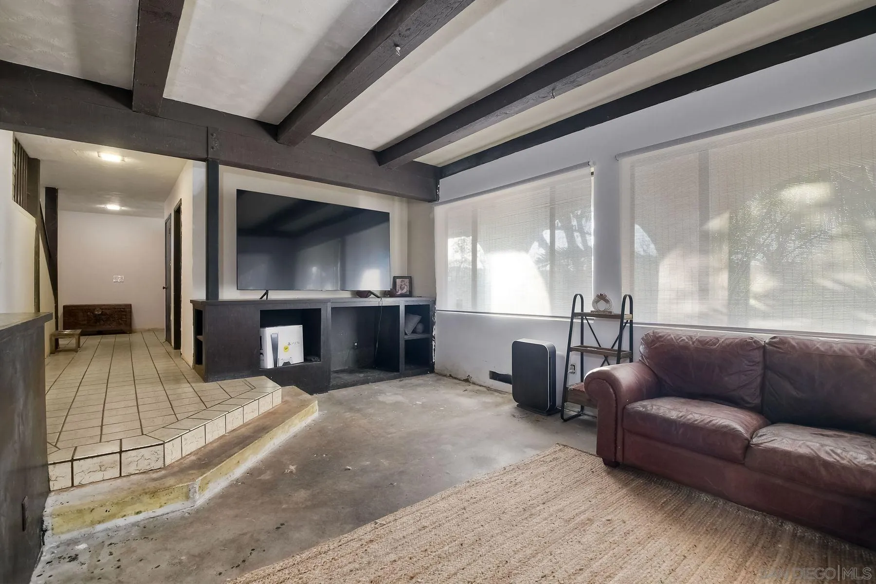 580 Stewart Canyon Road Fallbrook, CA 92028 - Photo 20 of 35 a living room with furniture and a flat screen tv
