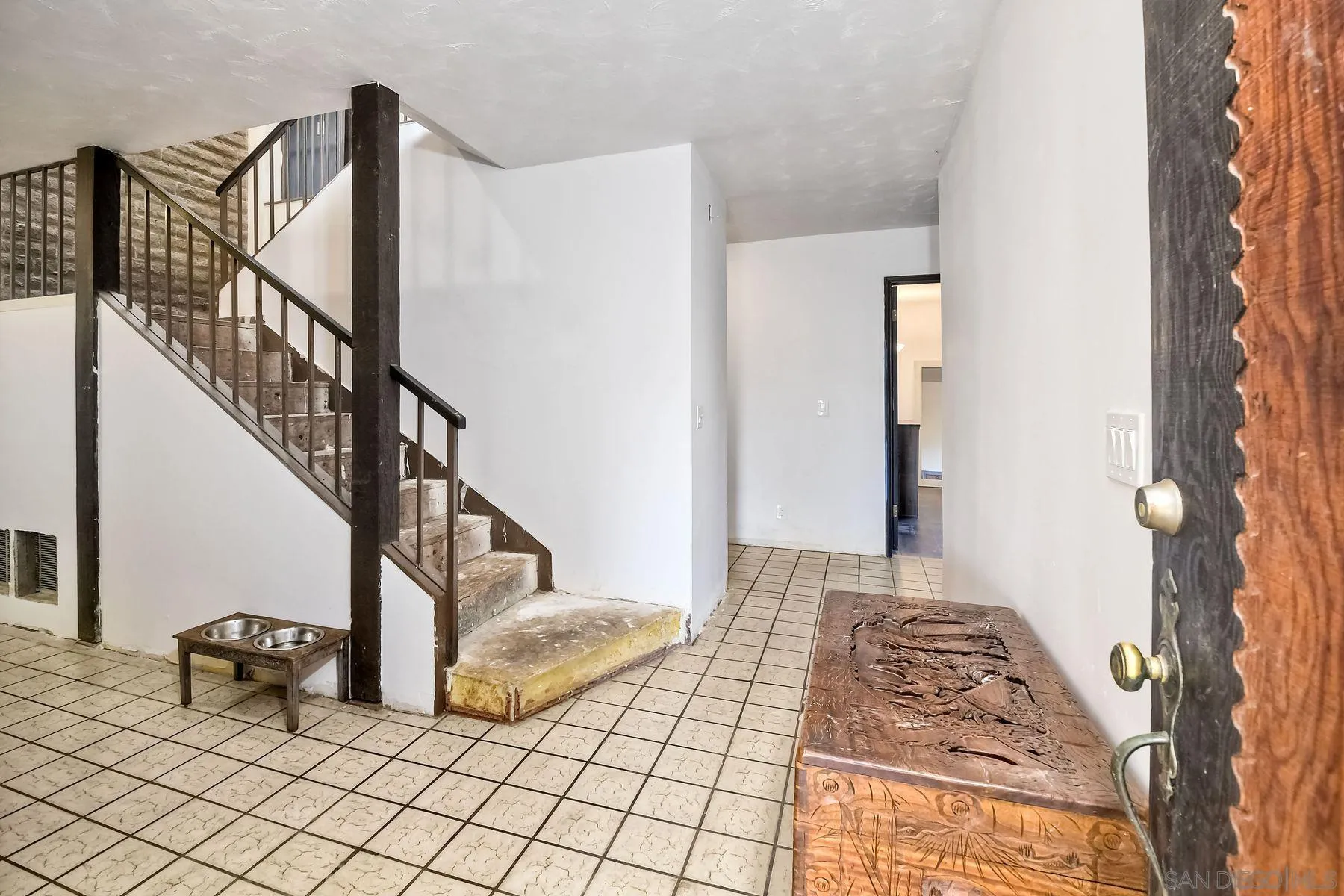 580 Stewart Canyon Road Fallbrook, CA 92028 - Photo 8 of 35 a view of a bedroom with wooden floor and stairs