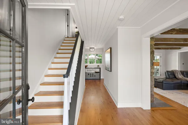 a bedroom with a large bed and a large window