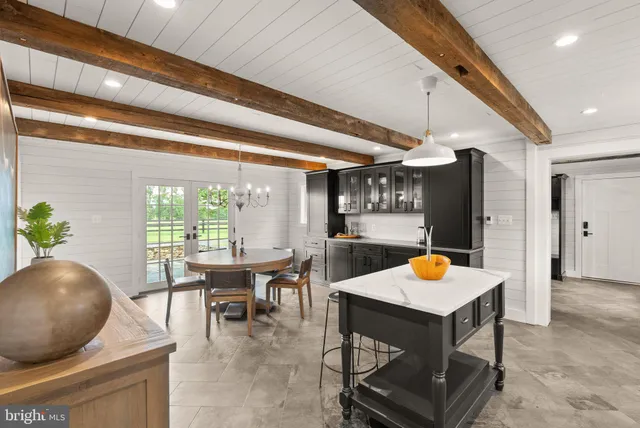 a bedroom with a bed and a view of bathroom