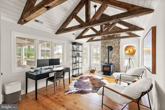a lobby with furniture and floor to ceiling window