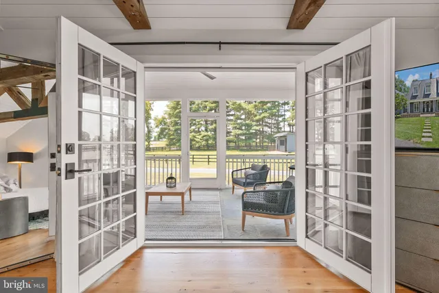 a view of a house with backyard porch and sitting area