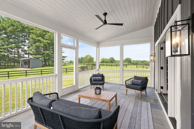 wooden floor in an empty room with a kitchen