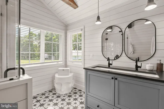 a large kitchen with a table and chairs