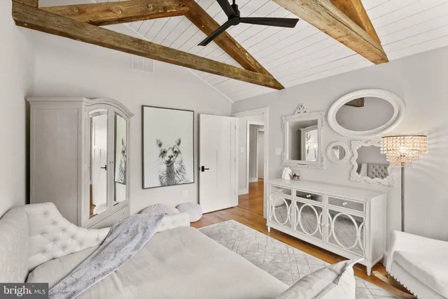 an aerial view of a house with swimming pool garden and trees