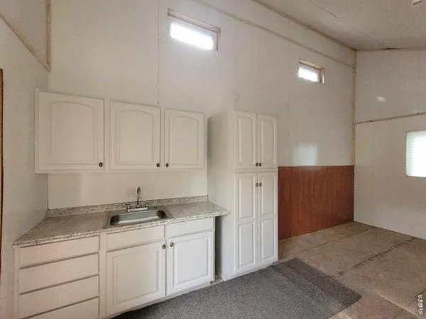 a view of empty room with windows